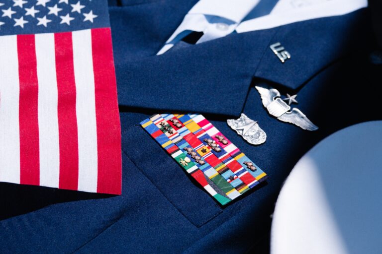 a blue uniform with an american flag and badges on it