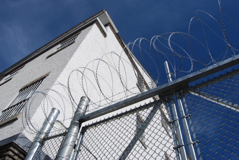 a fence with barbed wire