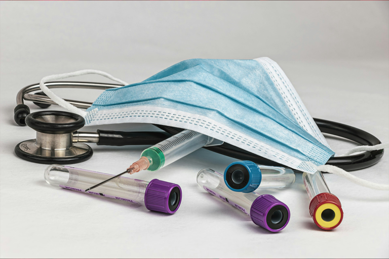 Stethoscope, mask, syringe, and 4 blood vials