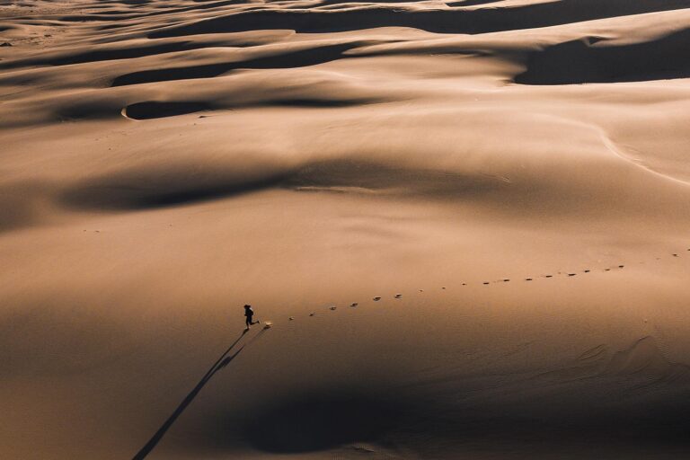 Person running through an endless desert