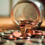 Coins spilling out of a jar