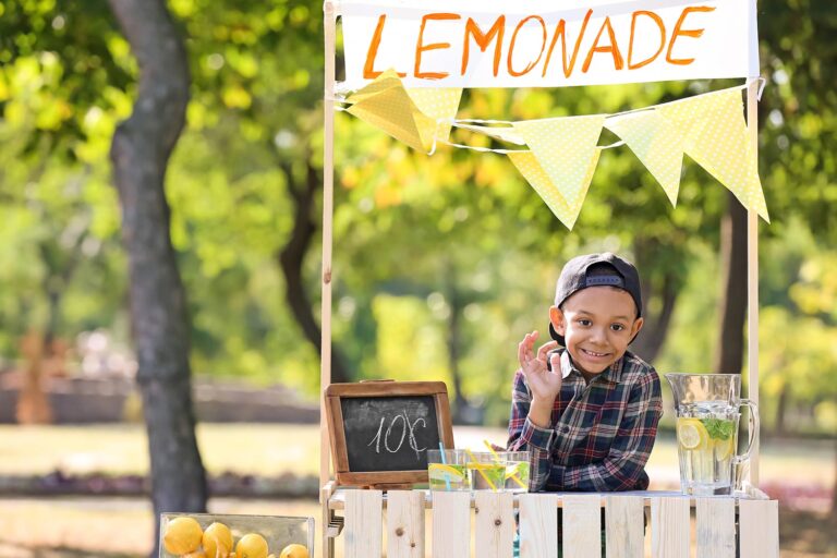 Little boy a a lemonade stand