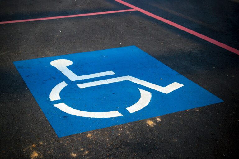 a parking spot with a blue handicap symbol painted on the ground