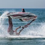 Jet Ski rider upside down in the water