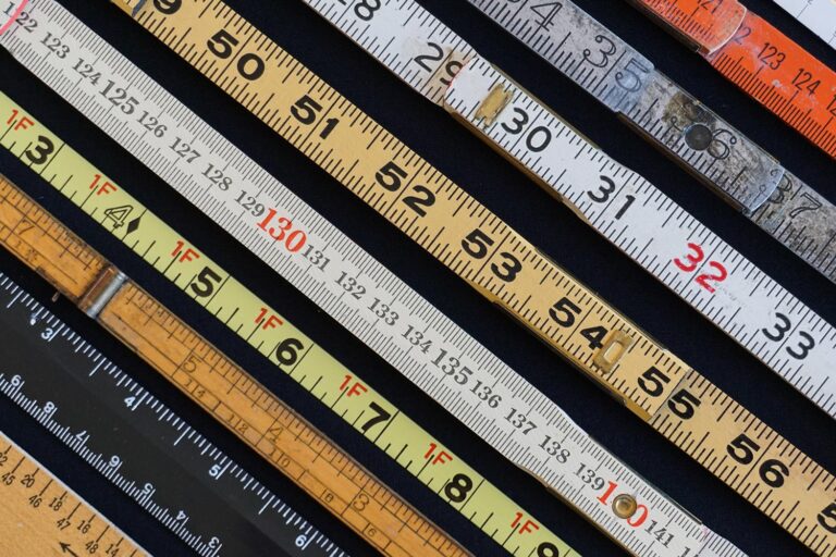 Close up of multiple rulers and measuring tapes