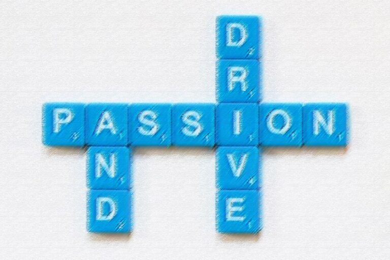 Blue Scrabble letters arranged to spell the words Passion and Drive