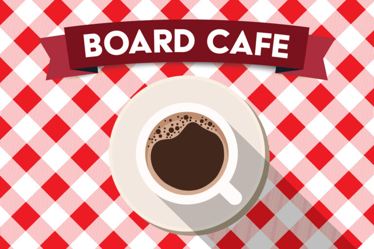 a cup of coffee on a tablecloth. Text reads Board Cafe
