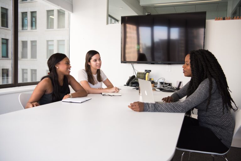 a group of women sitting at a table