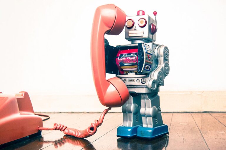 A toy robot making a phone call