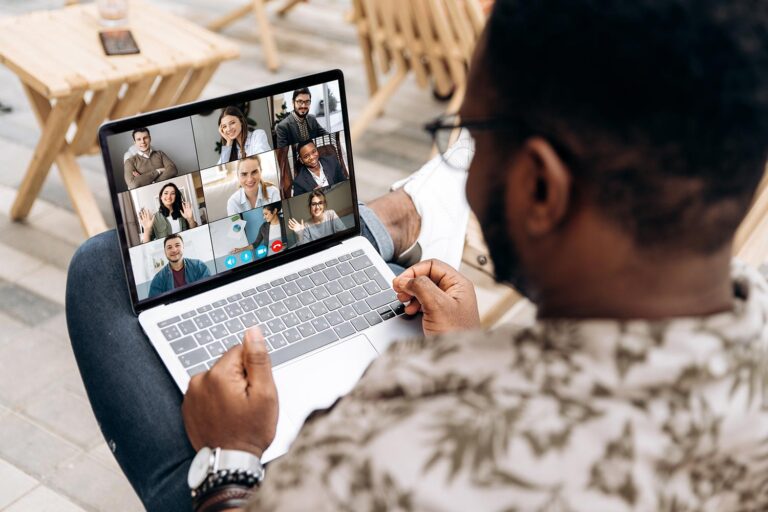 Man on a laptop having an online meeting