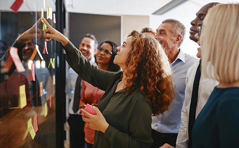 Diverse businesspeople brainstorming with sticky notes