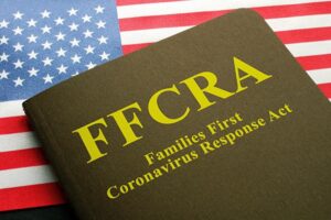 USA flag and families first coronavirus response act FFCRA law.