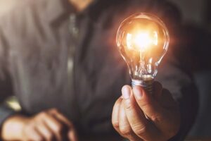hand holding light bulb. idea concept with innovation