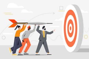 Diverse business teammates pointing arrow at target