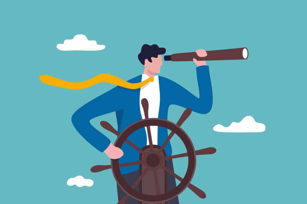 a person looking through a monocle while steering a ship