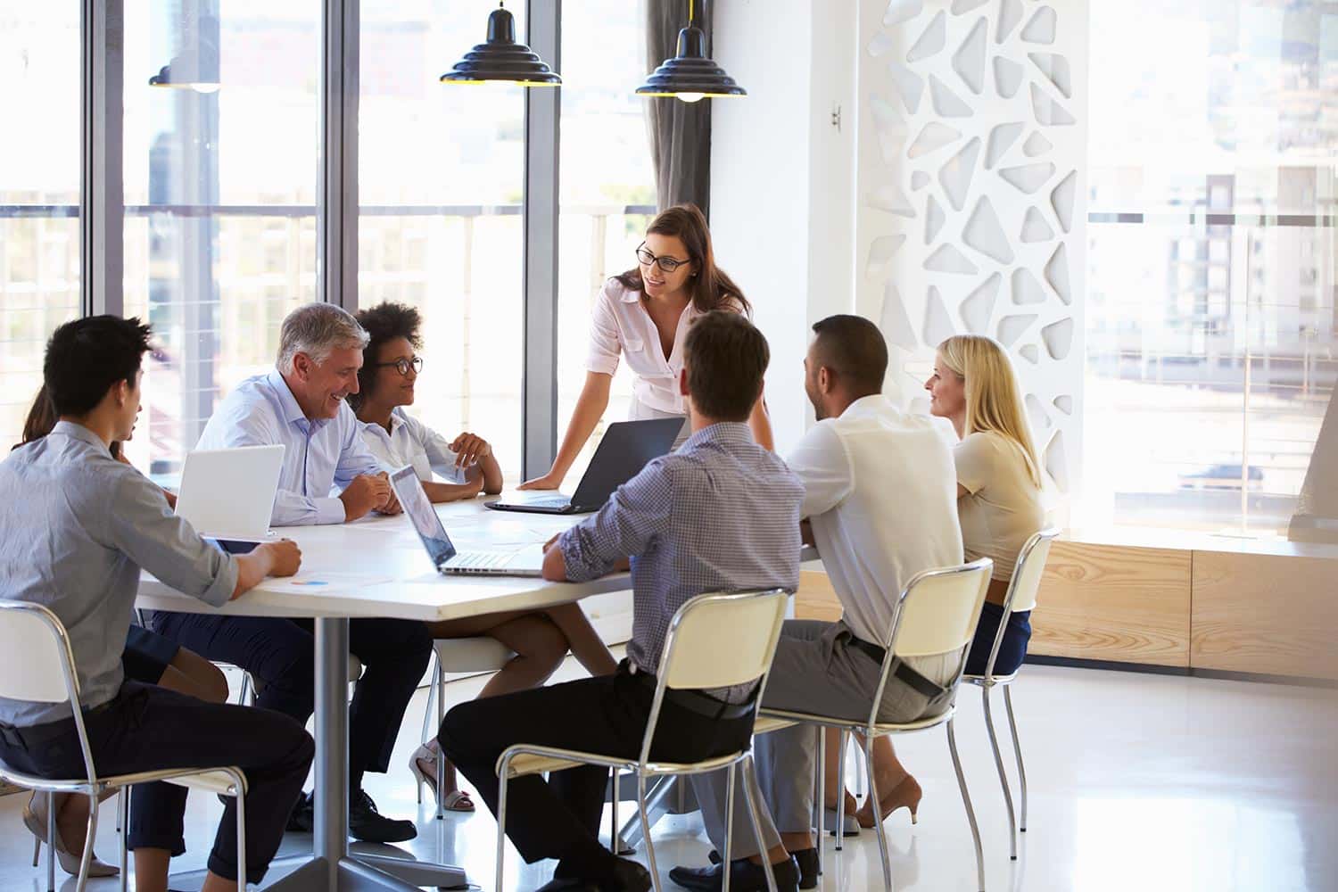 a group of people sitting around a table