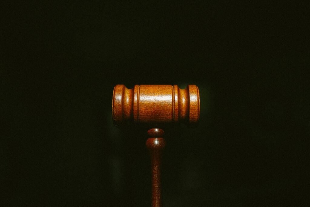 brown wooden gavel with black background