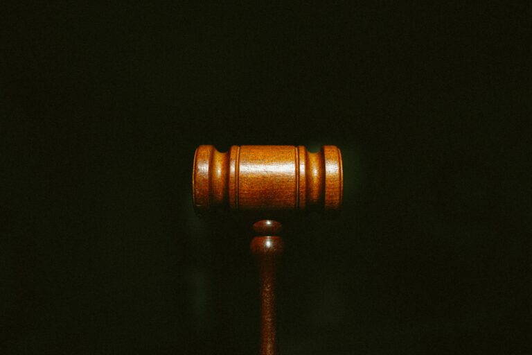 brown wooden gavel with black background