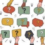 hands holding signs with question marks