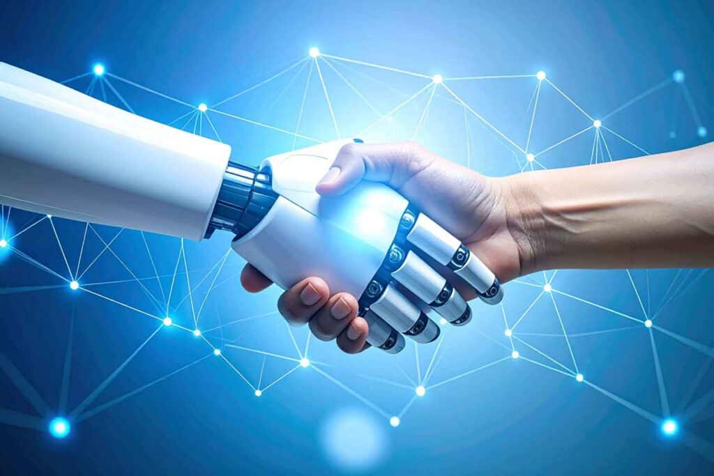 a hand holding a robot hand holding a light bulb