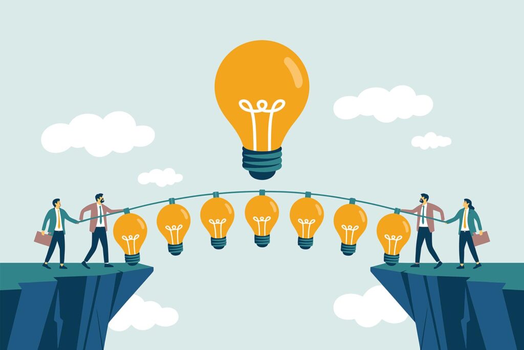 people hanging on a rope with light bulbs on a cliff