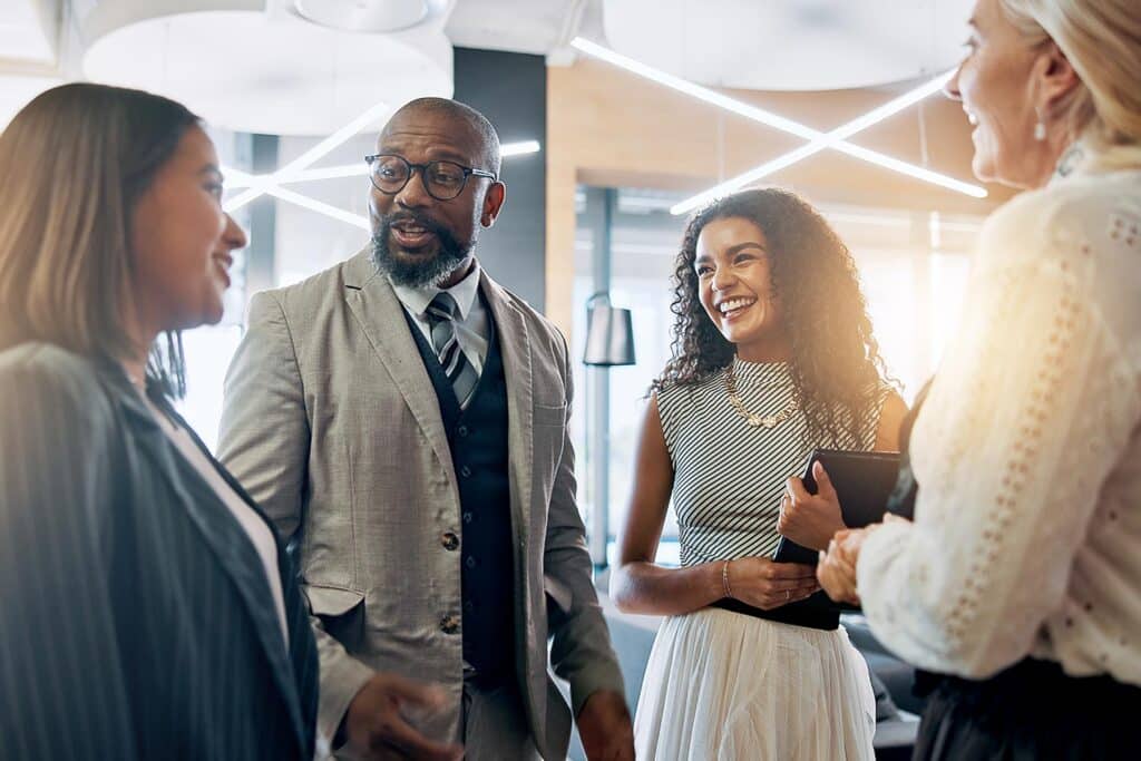 people standing and talking in an office