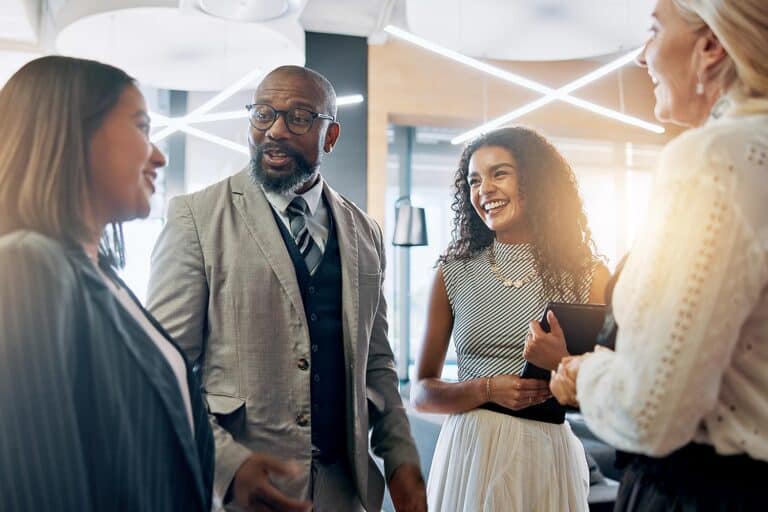 people standing and talking in an office